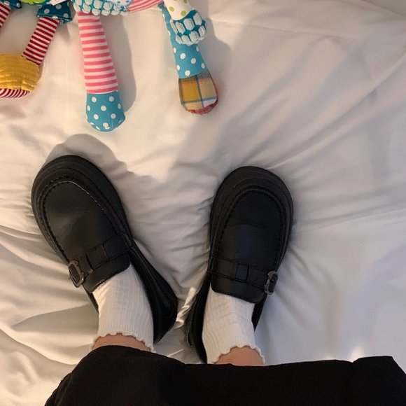 Fashionable small black leather shoes